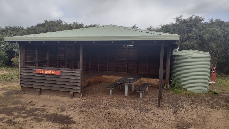 Modest three-sided shelter on Western Australia's 1000 km Bibbulmun Track.  Built and maintained by volunteers and Parks Service.  Provided with toilet, water, tent sites and table.  